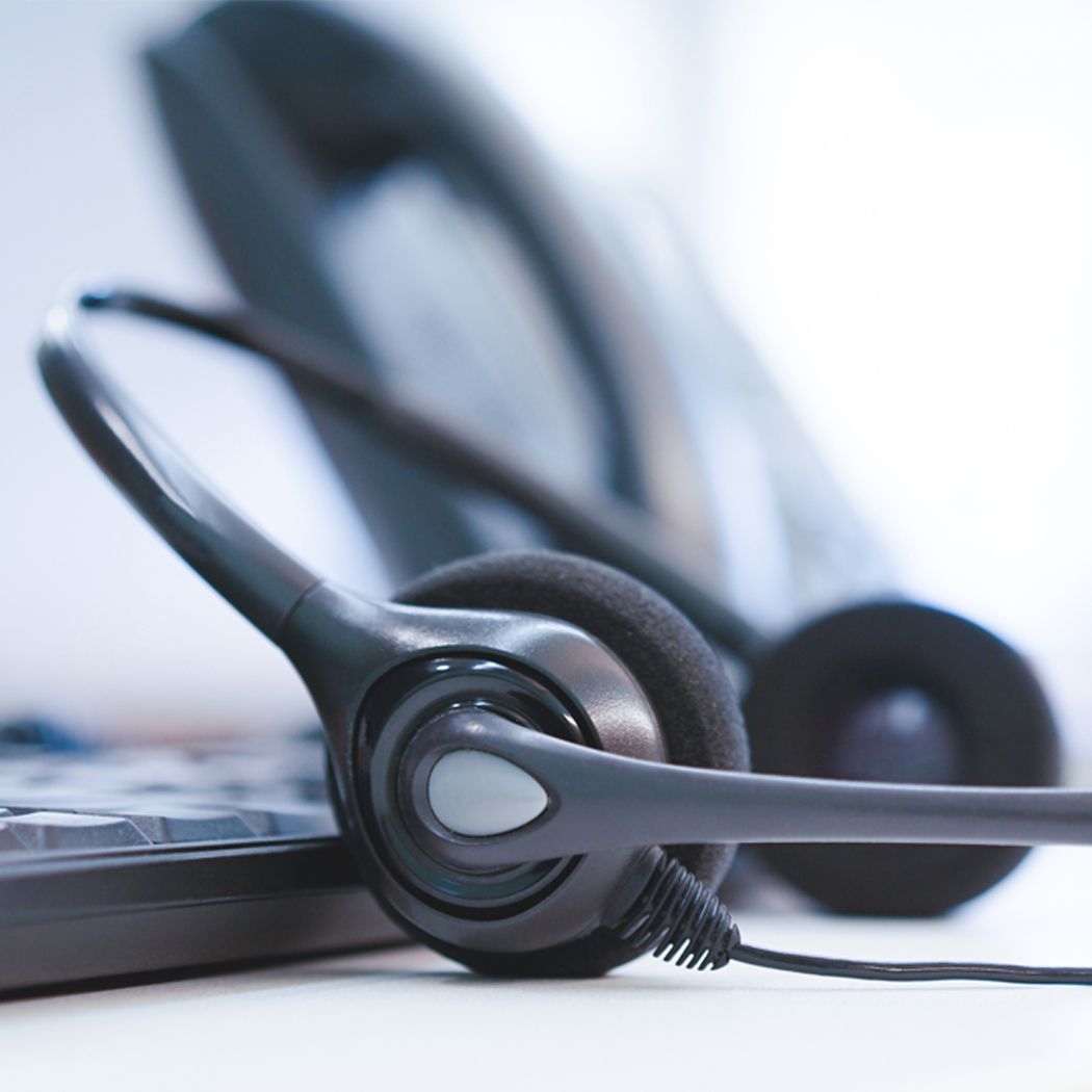 headphones on desk, AWS | DXC Technology